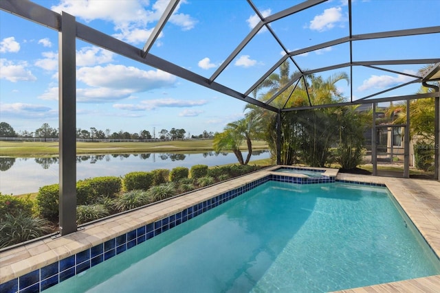 view of pool with glass enclosure and a water view