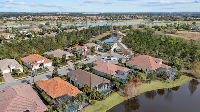 birds eye view of property featuring a water view and a residential view