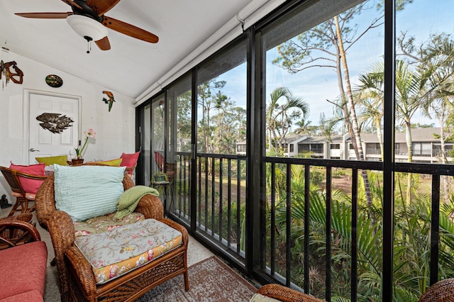 sunroom with ceiling fan and vaulted ceiling