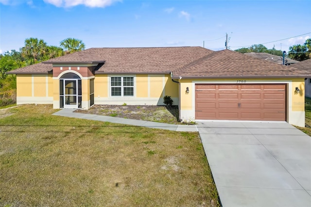 ranch-style house featuring a garage and a front lawn