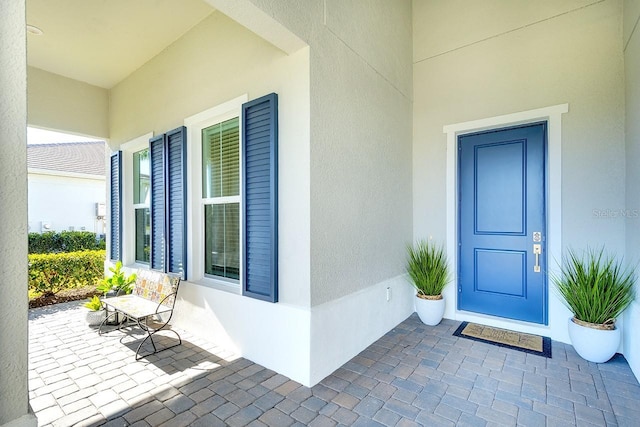 doorway to property featuring a porch