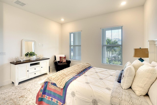 bedroom with light tile patterned floors