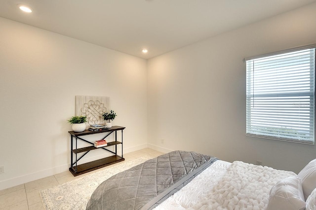 bedroom featuring tile patterned flooring and multiple windows