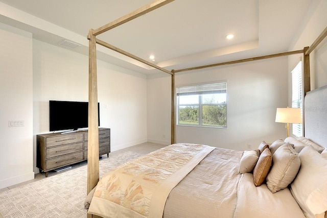 bedroom with a raised ceiling