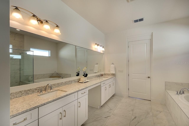 bathroom with vanity and separate shower and tub