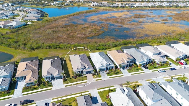 drone / aerial view featuring a water view