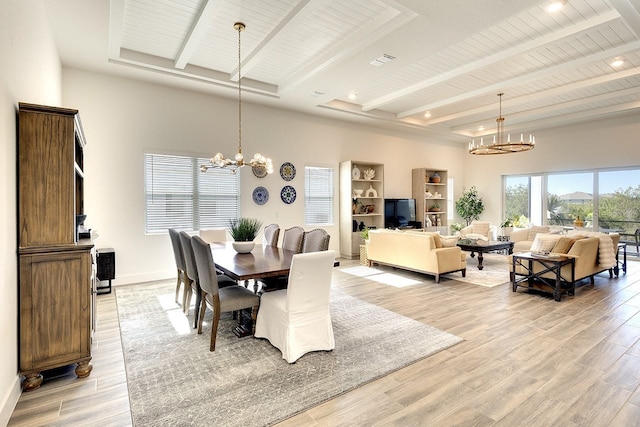 dining space featuring beamed ceiling, wood ceiling, an inviting chandelier, and light hardwood / wood-style flooring