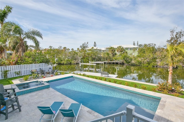 view of pool featuring a water view, an in ground hot tub, a patio, and a boat dock