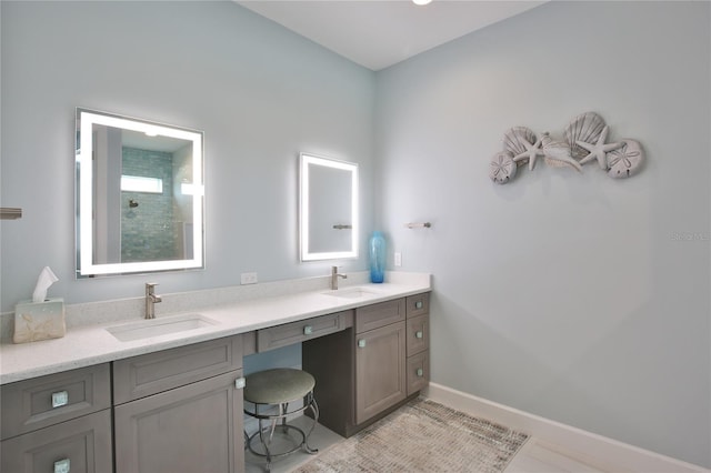 bathroom with vanity and a shower