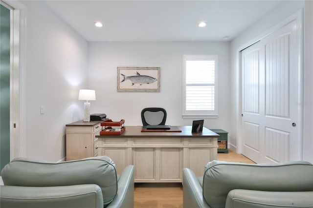 office with light hardwood / wood-style floors