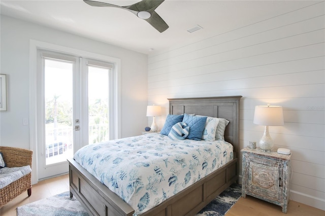 bedroom with access to outside, ceiling fan, and light hardwood / wood-style flooring