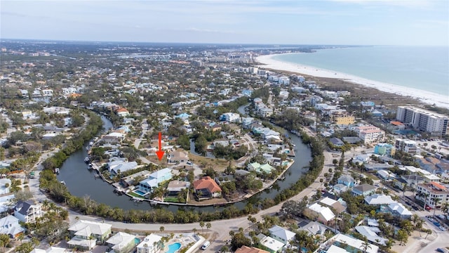 bird's eye view featuring a water view and a view of the beach