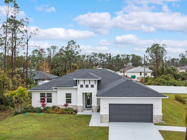 view of front facade with a garage and a front lawn