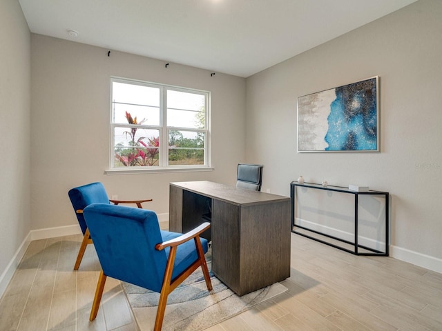 home office with light wood-type flooring