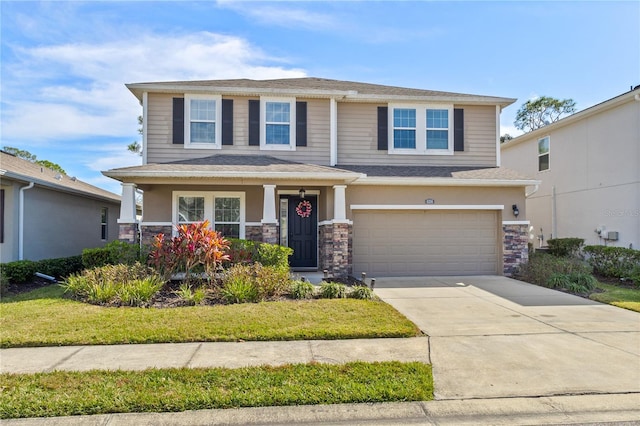 view of front of house with a garage, a porch, and a front lawn