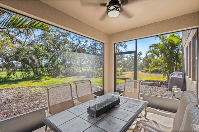 sunroom / solarium with ceiling fan