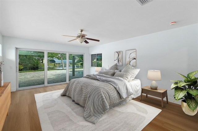 bedroom with ceiling fan and light wood-type flooring