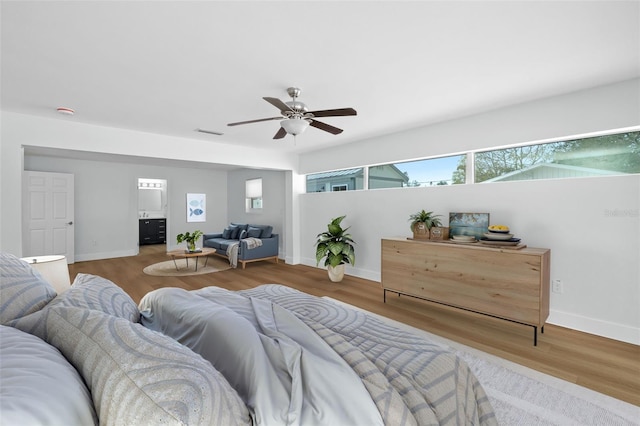 bedroom featuring hardwood / wood-style flooring and ceiling fan