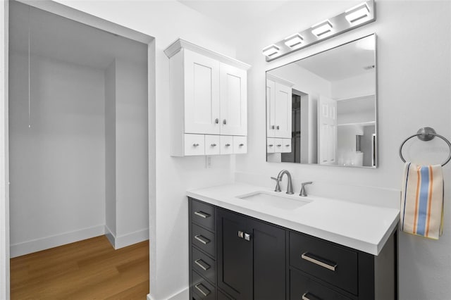 bathroom featuring vanity and hardwood / wood-style floors