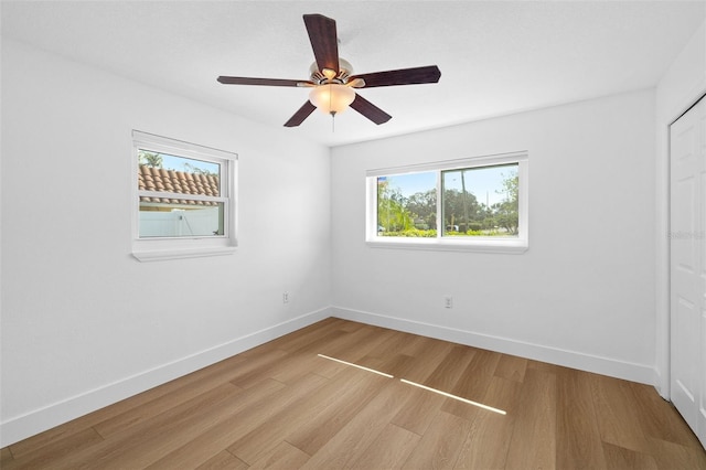 spare room with ceiling fan and light hardwood / wood-style floors