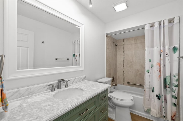 full bathroom featuring vanity, shower / tub combo, and toilet