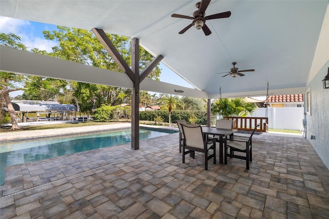 view of swimming pool featuring a patio and ceiling fan