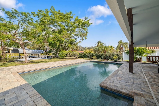 view of pool featuring a patio area