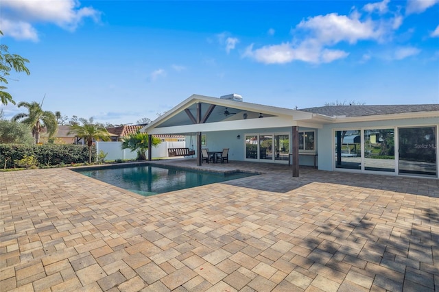 view of pool with ceiling fan and a patio area