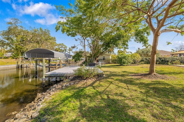 dock area featuring a yard and a water view