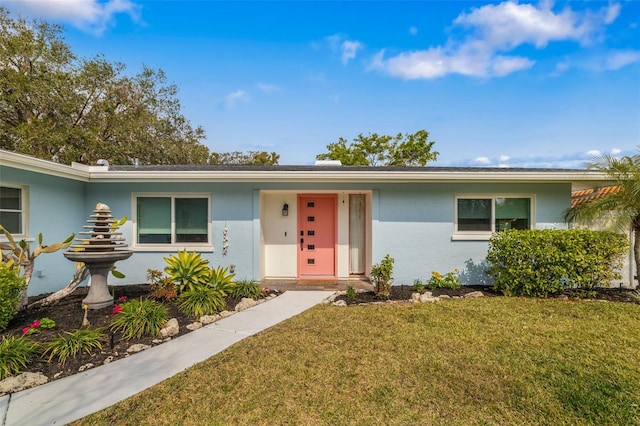 ranch-style home with a front yard