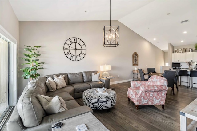 living room with an inviting chandelier, high vaulted ceiling, and dark hardwood / wood-style floors