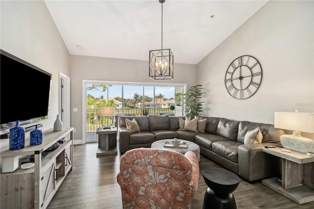 living room with high vaulted ceiling, dark hardwood / wood-style floors, and a chandelier