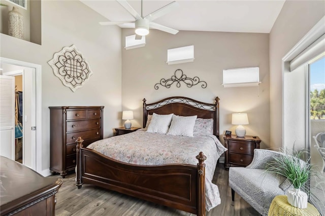 bedroom with vaulted ceiling and light hardwood / wood-style floors