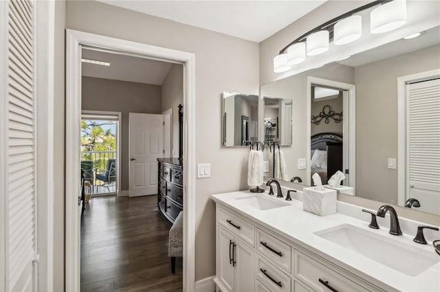 bathroom featuring vanity and hardwood / wood-style flooring