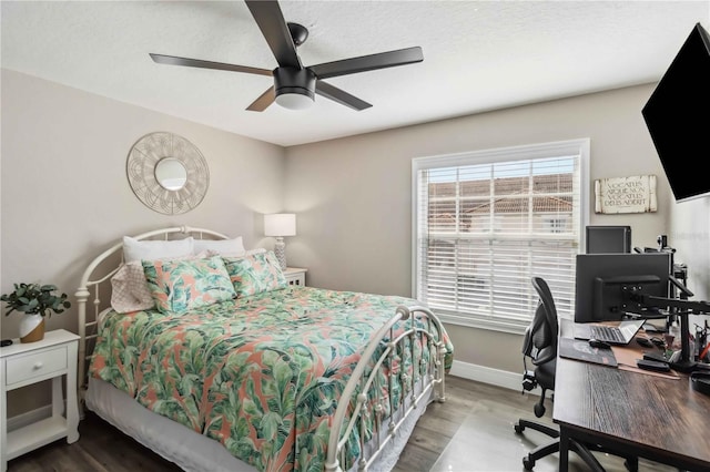 bedroom featuring hardwood / wood-style floors and ceiling fan