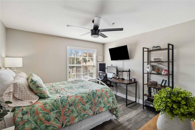 bedroom featuring hardwood / wood-style flooring and ceiling fan