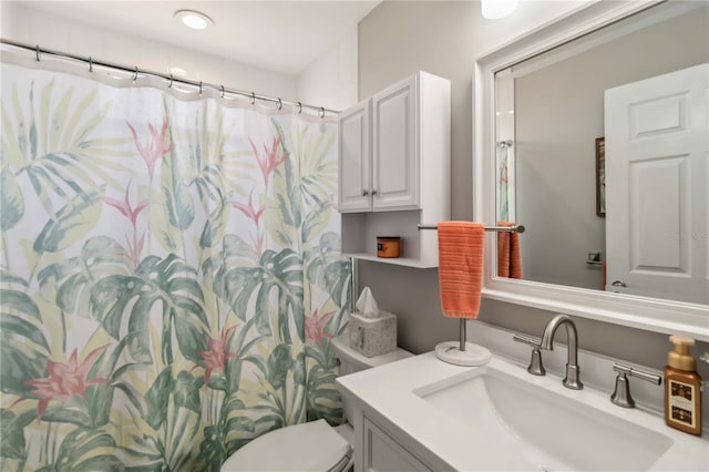 bathroom with vanity and toilet