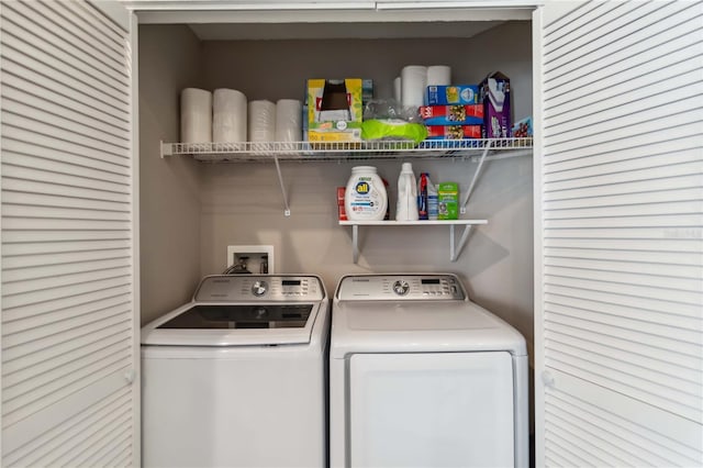 laundry room with independent washer and dryer