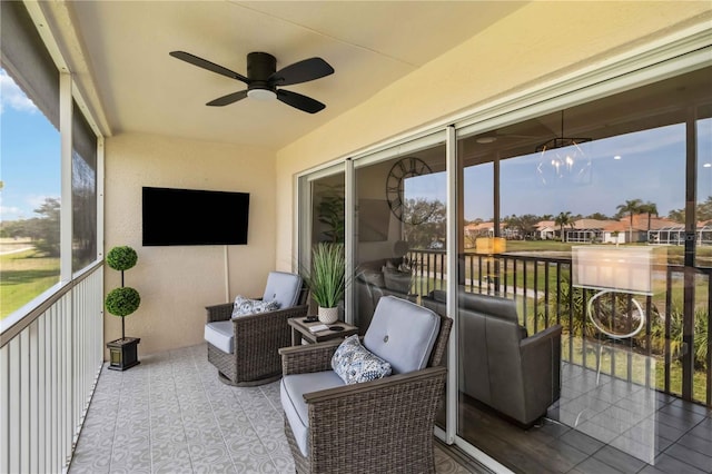 sunroom with a wealth of natural light and ceiling fan