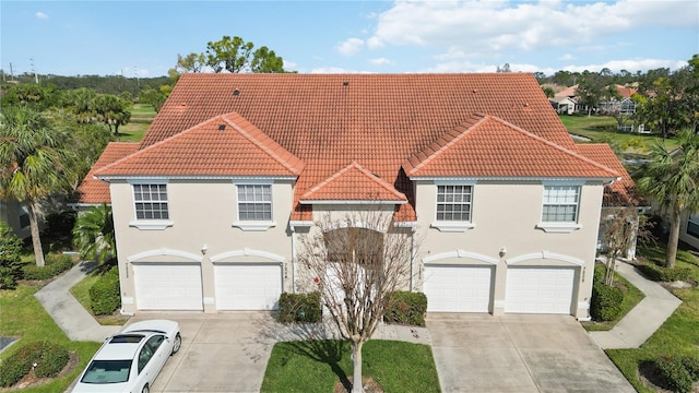 mediterranean / spanish-style house featuring a garage