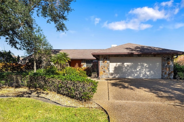 ranch-style house featuring a garage