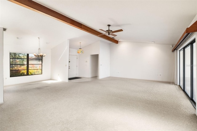 spare room featuring ceiling fan with notable chandelier, lofted ceiling with beams, carpet, and a wealth of natural light