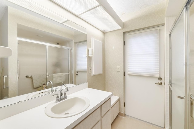 bathroom featuring vanity and walk in shower