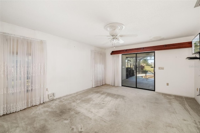 unfurnished room with ceiling fan and light colored carpet