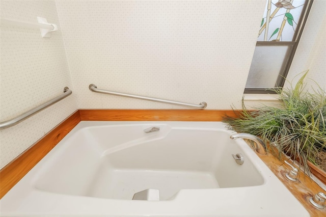 bathroom with a tub