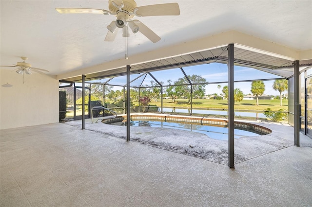 view of pool with a water view and ceiling fan