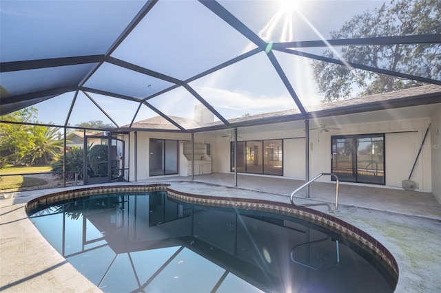 view of pool with a patio, a lanai, and ceiling fan