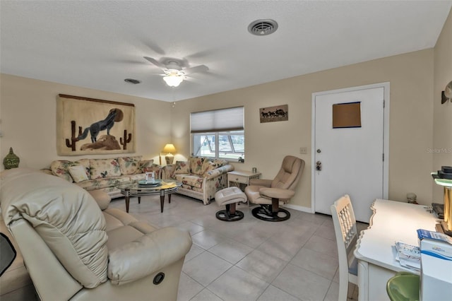 tiled living room featuring ceiling fan