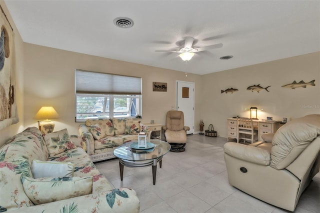 living room featuring light tile patterned floors and ceiling fan