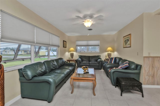 living room with light tile patterned floors and ceiling fan